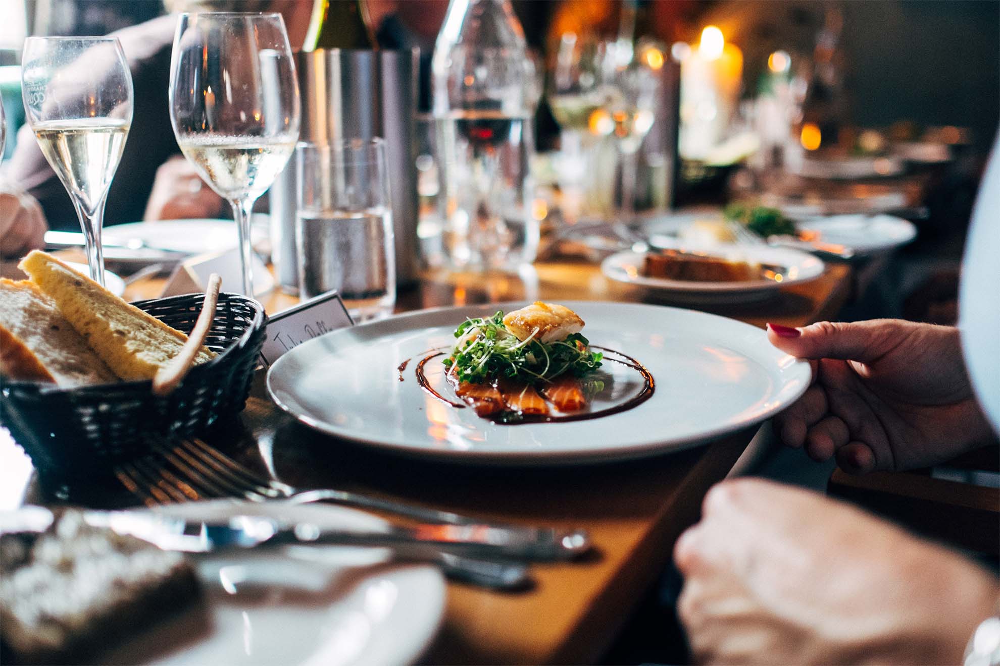 residents sat down for a meal together with prosecco
